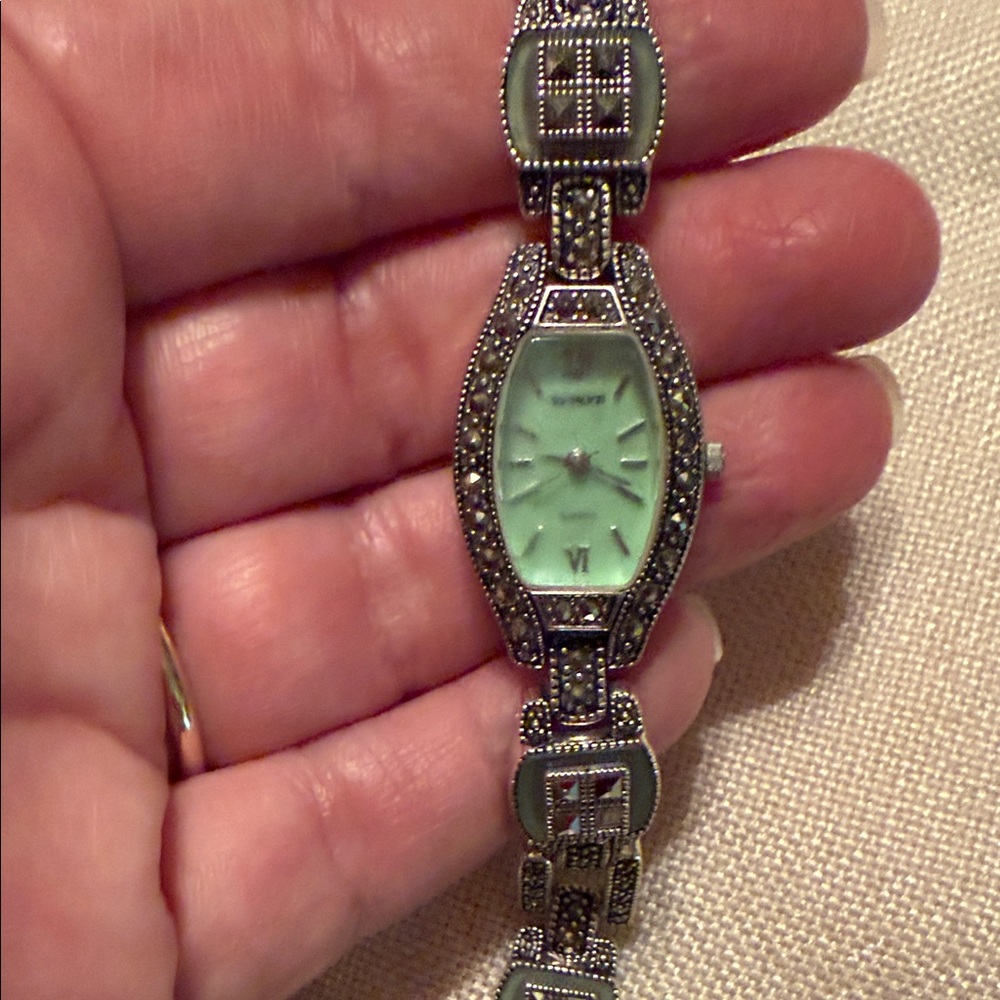 Silver watch with Marcasites and Green stones